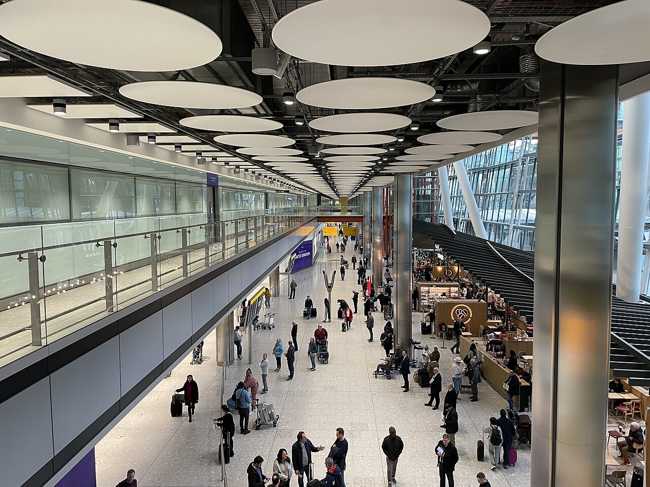 Passengers in the Heathrow Terminal 5 arrivals hall