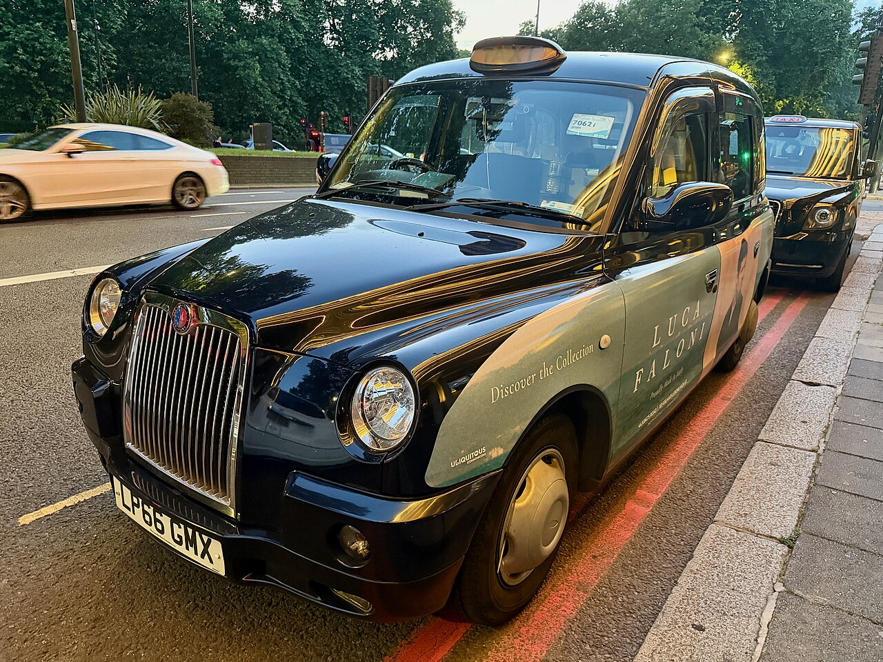 Classic London black cab parked on a city street